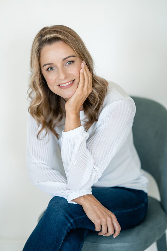 Anne Schady, smiling warmly